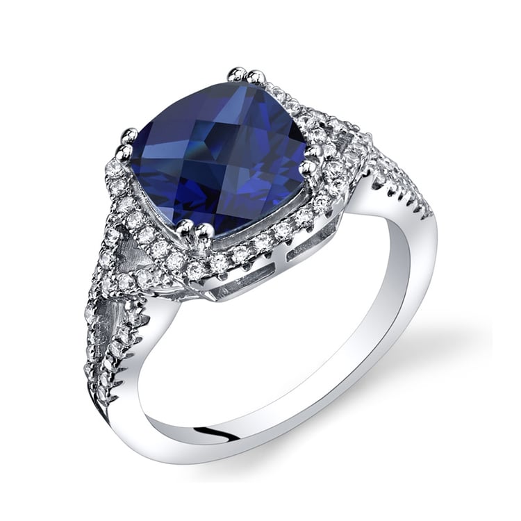 Stříbrný prsten s cushion safírem a zirkony 