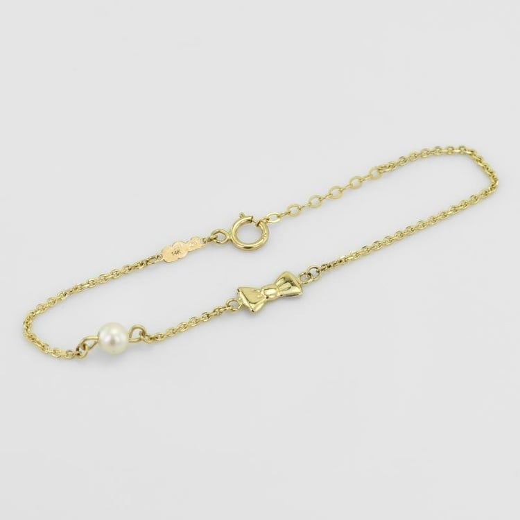 Zlatý dětský náramek s mašličkou a perlou 51521