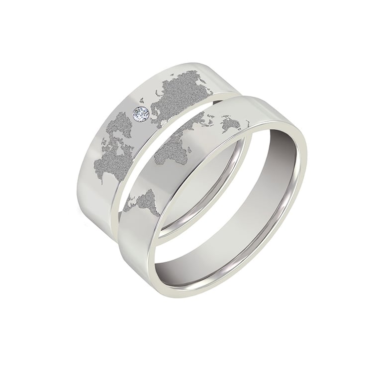 Snubní prsteny ze zlata s gravírem zeměkoule a diamantem Zeoni