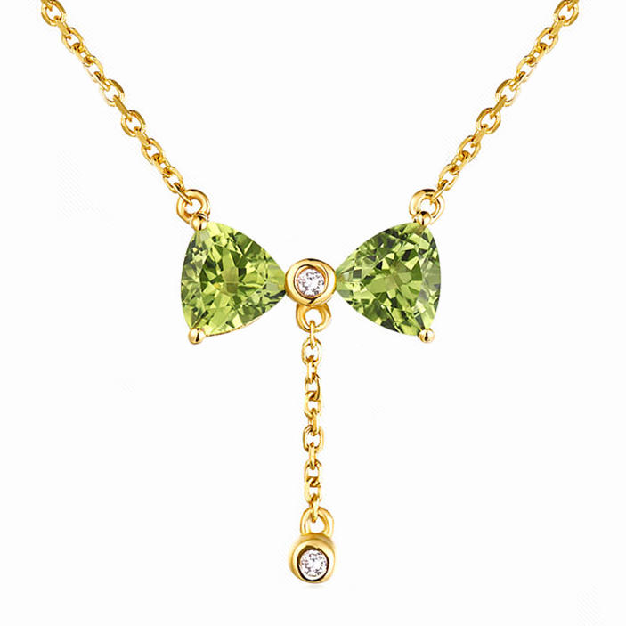Zlatá olivínová mašlička s diamanty v náhrdelníku