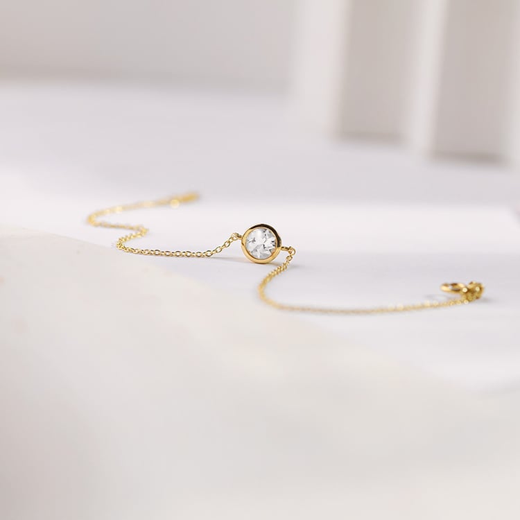 Zlatý náramek s bílým topazem Arleth 153088