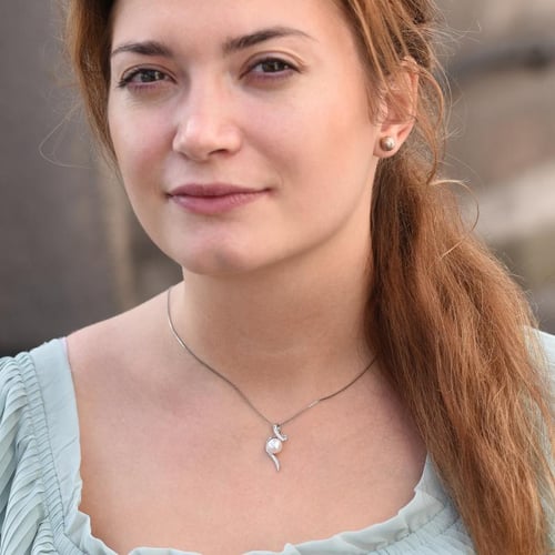 Stříbrný přívěsek s perlou a zirkony Acanda