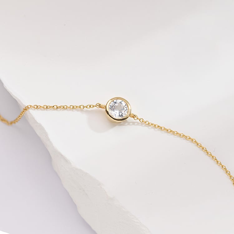 Zlatý náramek s bílým topazem Arleth 152689