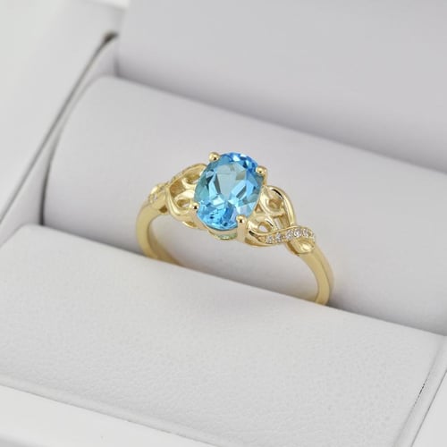 Zlatý prsten se švýcarským topazem a diamanty Alanyse