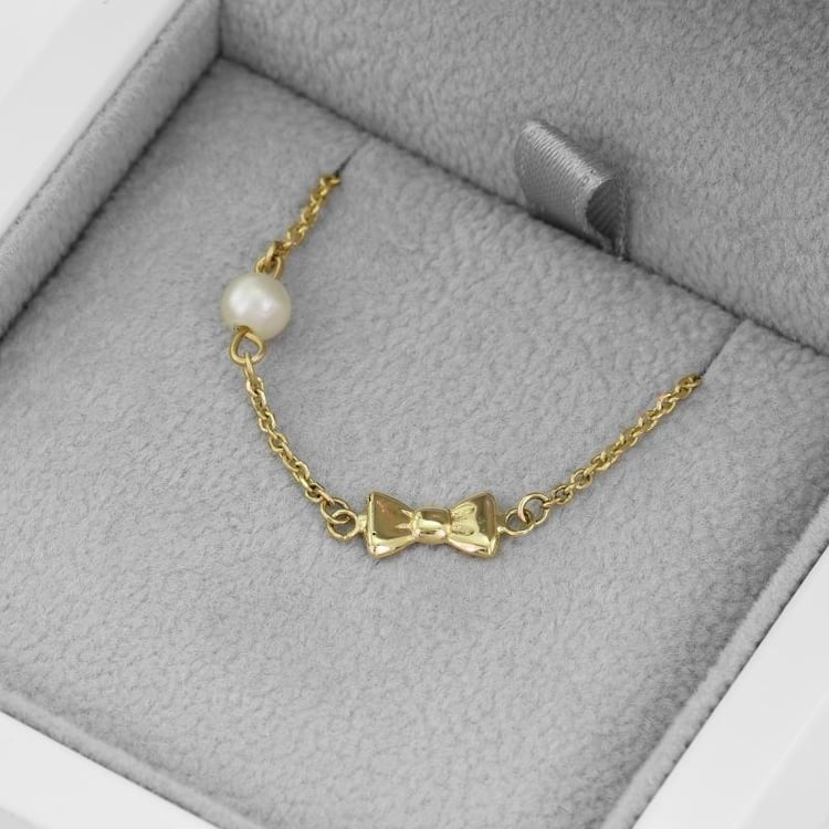 Dětský náramek s mašličkou a perlou 51522