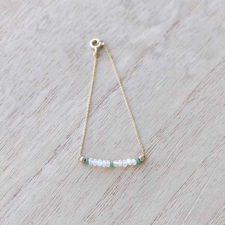 Zlatý náramek se smaragdovými korálky 61946