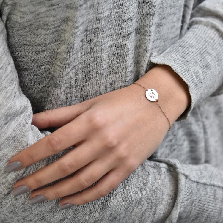 Zlatý náramek se znamením a smaragdem 37719