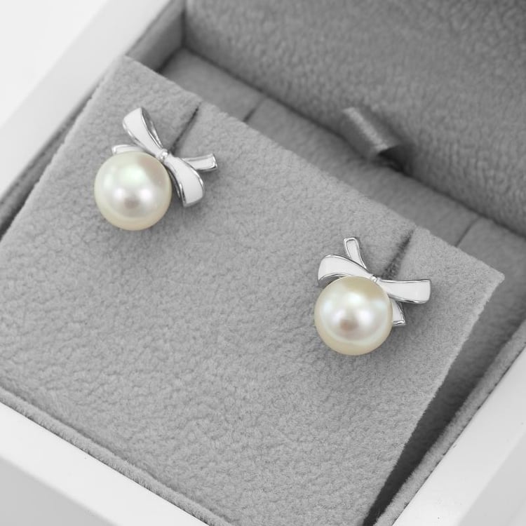 Perlové napichovací náušnice s mašličkami 50389