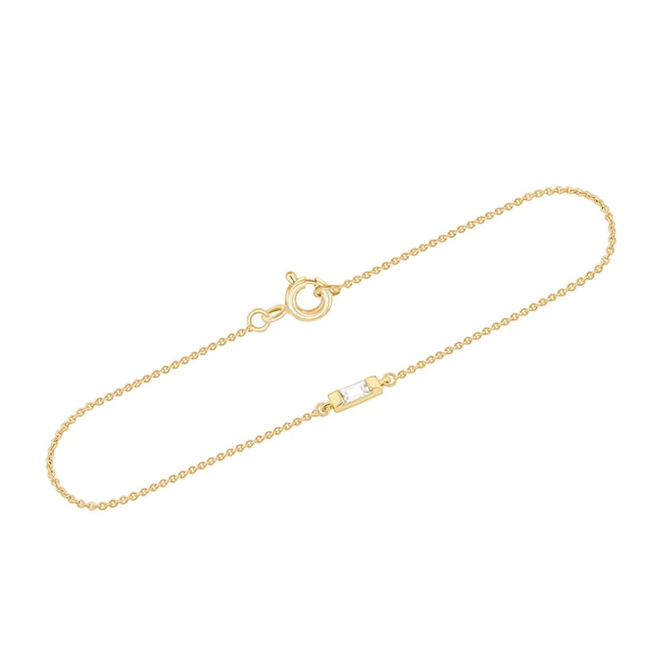 Minimalistický zlatý náramek s bílým safírem