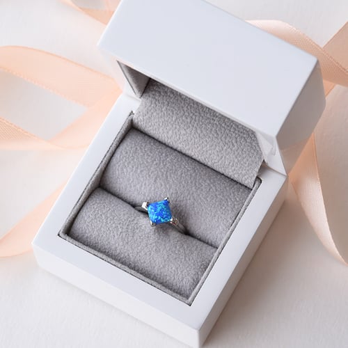 Opálový stříbrný prsten plný barev oceánu Neola